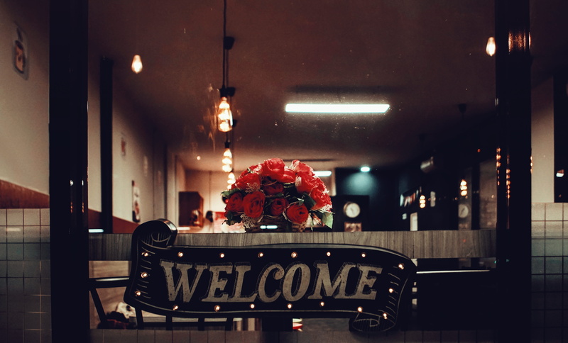 text, architecture, night, arrangement, 5K, flower arrangement, lighting equipment, furniture, lamp, signage, communication, rustic, restaurant, western script