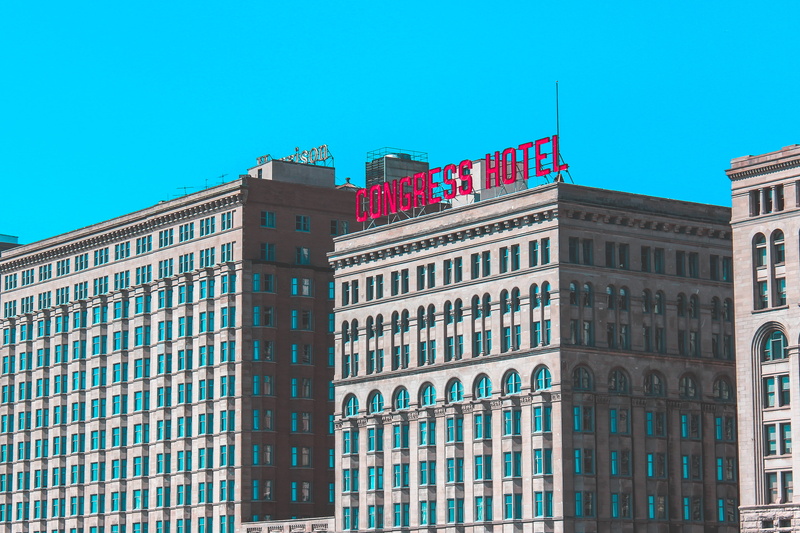 angle, housing, office building exterior, architecture, no people, blue, urban, sky, sign, window, built structure, downtown, flag, low, apartment building