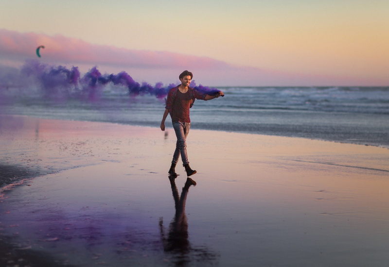 daytime, land, beauty in nature, coast, nature, shore, holding, leisure activity, seashore, motion, sky, beach, waves, ocean, alone, full length, horizon