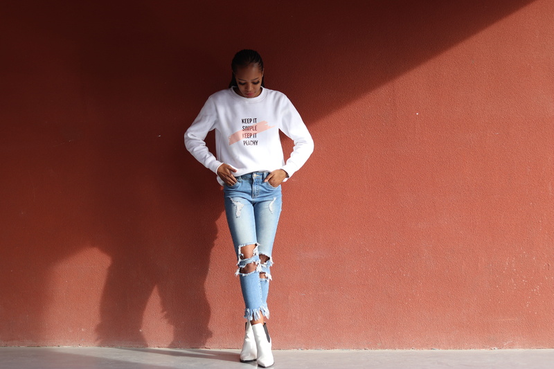 casual clothing, front view, 5K, full length, crossing, outdoors, jeans, real people, legs, architecture, sunlight, lifestyles, looking at camera, one person