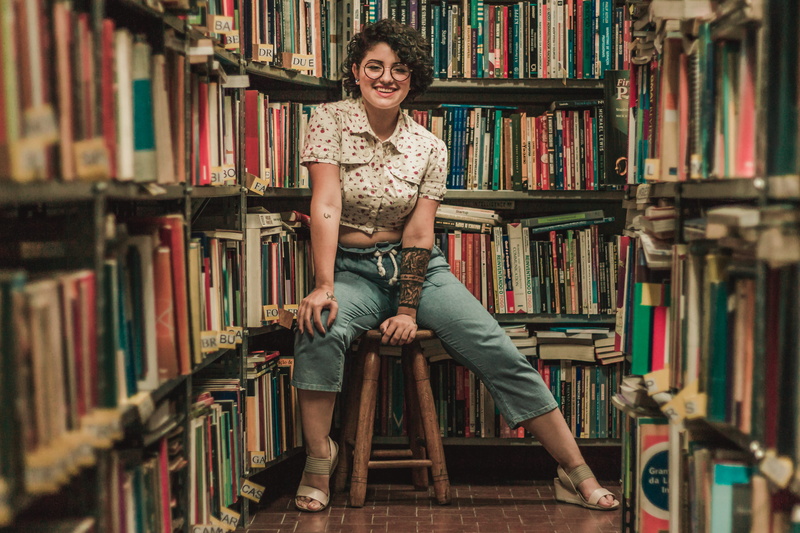 happy, indoors, bookstore, one person, woman, smiling, barstool, library, book, 5K, trendy, student, looking at camera, education, style, lifestyles, shelf