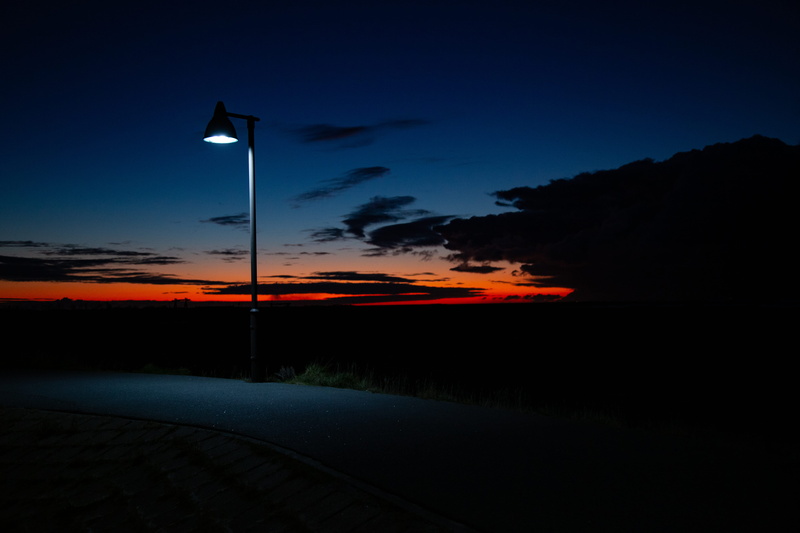 bird, lamp post, street light, street, lampost, lamp, sky, nightime, germany, city, dark, red sky, illuminated, sundown, no people, orange color, nessmersiel