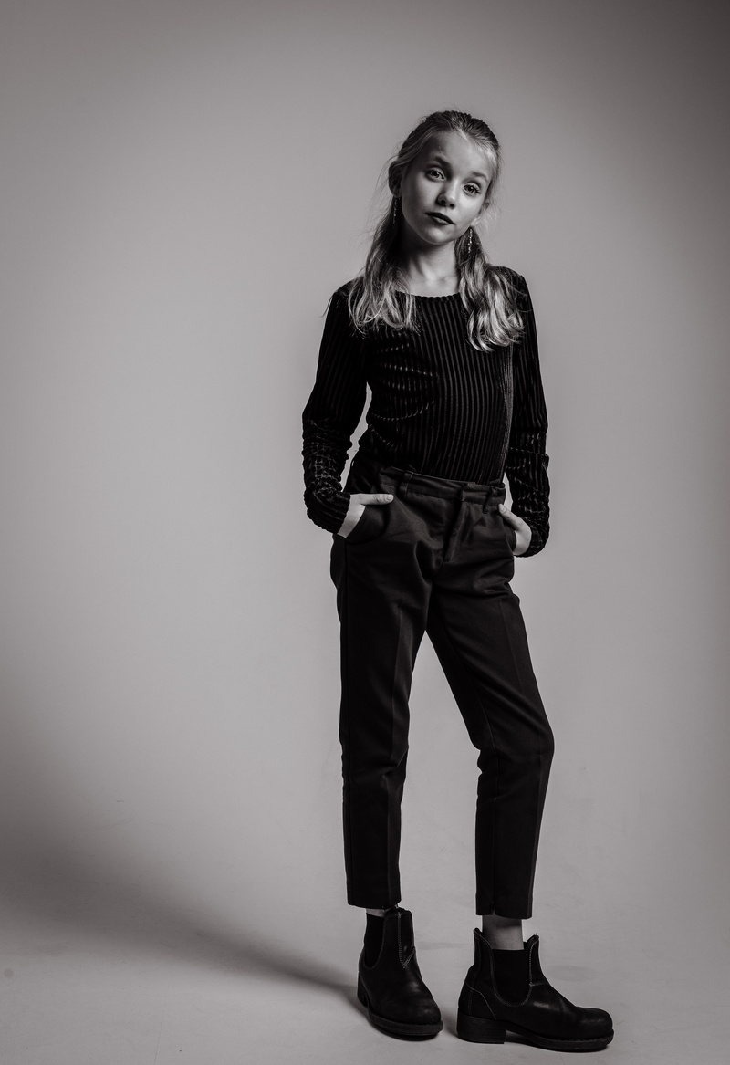 person, studio, long sleeves, studio shot, girl, front view, grayscale, pants, adolescent, model, 5K, jeans, hair, attitude, portrait, full length, long