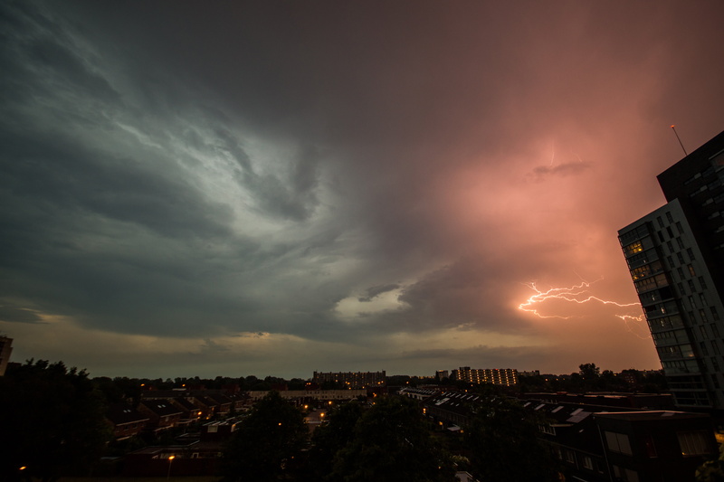 skyscraper, dramatic sky, building, built structure, city life, power in nature, cloud - sky, red, architecture, building exterior, city, ominous, sky