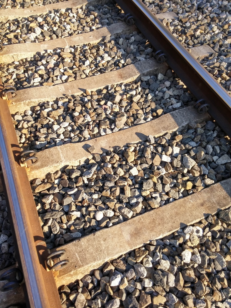 large group of objects, outdoors, no people, wood - material, concrete, rock - object, 4K, gravel, solid, rail transportation, nature, railroad tie, gray