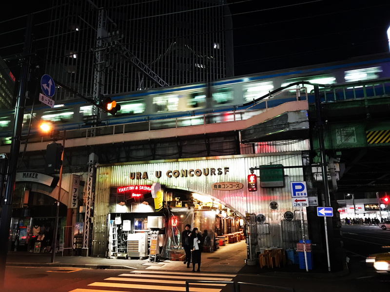 mode of transportation, blurred motion, illuminated, public transportation, road, text, transportation, standing, sign, pedestrian, signage, near, communication