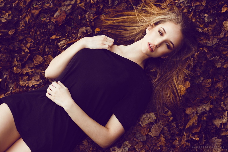 black dress, young women, nature, 1080P, portrait, outdoors, lying on back, hair, leaves, beauty, leaf, beautiful woman, looking at camera, lying down