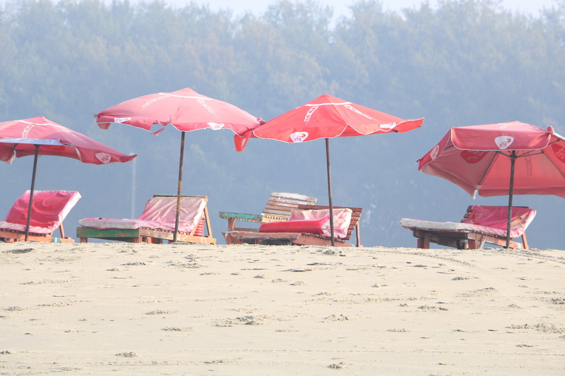 land, tranquil scene, security, shade, day, tranquility, nature, water, relaxing chair, chair, protection, umbrella, sunlight, no people, parasol, outdoors