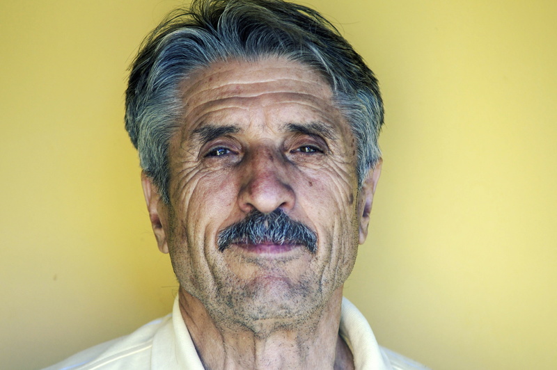 mustache, top, headshot, looking at camera, face, close-up, human face, man, mature adult, white hair, person, collard, beard, wearing, hairstyle, adult
