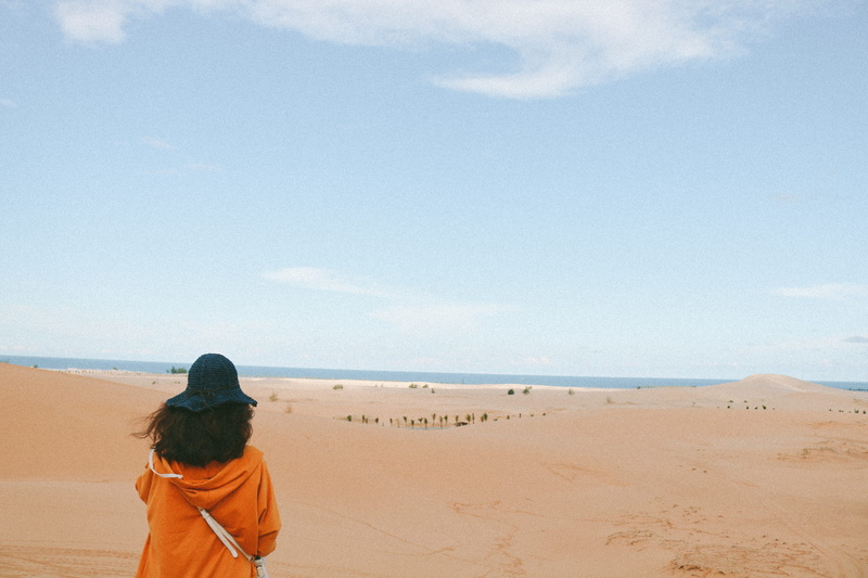 one person, people, nature, photography, day, desert, blue, dune, sand, leisure activity, soil, scenics - nature, looking at view, person, outdoors, horizon