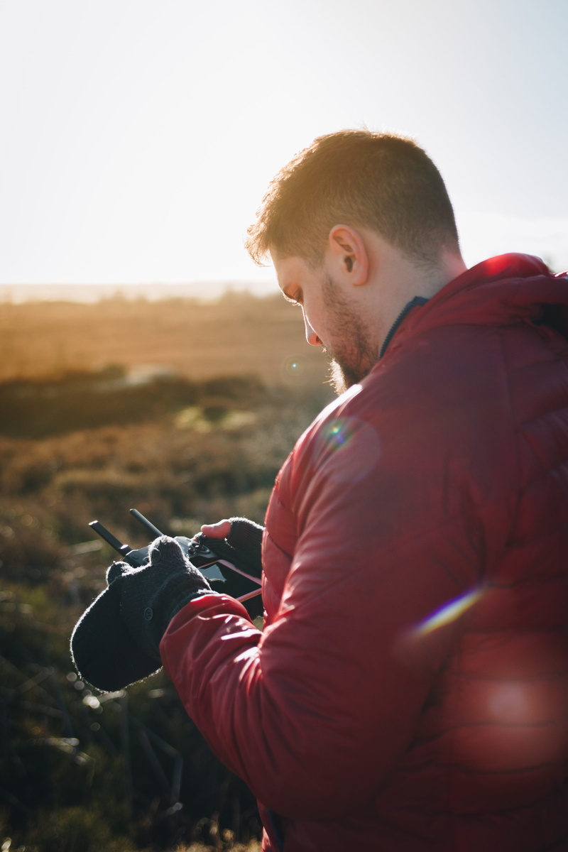 man, controls, sky, red, young men, nature, looking, young adult, 4K, adventure, remote, lifestyles, side view, jacket, casual clothing, sunlight, one person