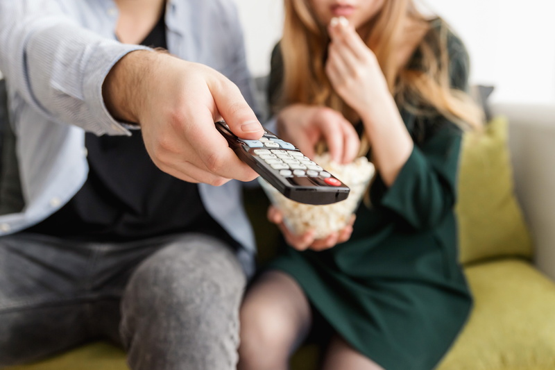 business, sitting, casual, hand, communication, remote, family, women, finance, sit, sofa, room, man, relaxation, lifestyle, food, focus on foreground