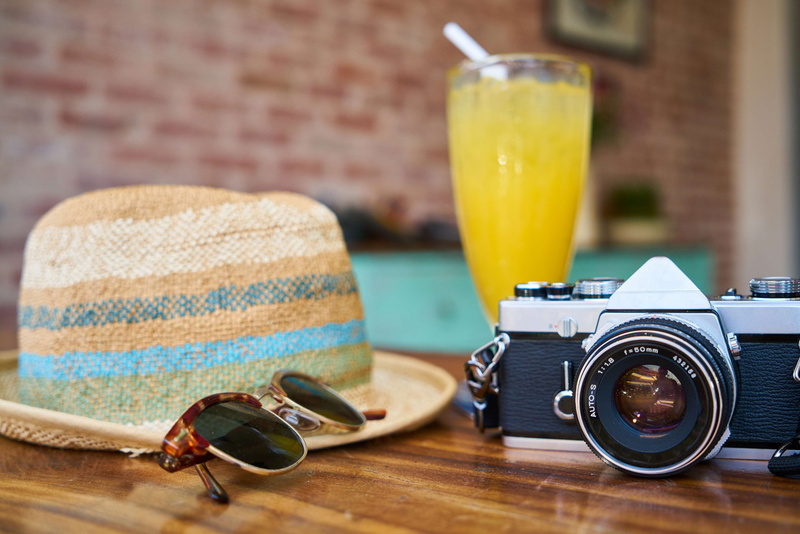 equipment, focus on foreground, drink, photography themes, food, hat, sunglasses, food and drink, fruit juice, fashion, digital camera, caf, holiday, glasses