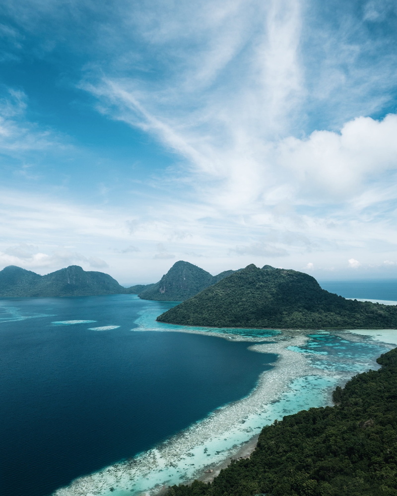 beach, tranquil scene, beauty in nature, travel, promontory, landscape, non-urban scene, scenics - nature, green, peninsula, nature, water, day, island