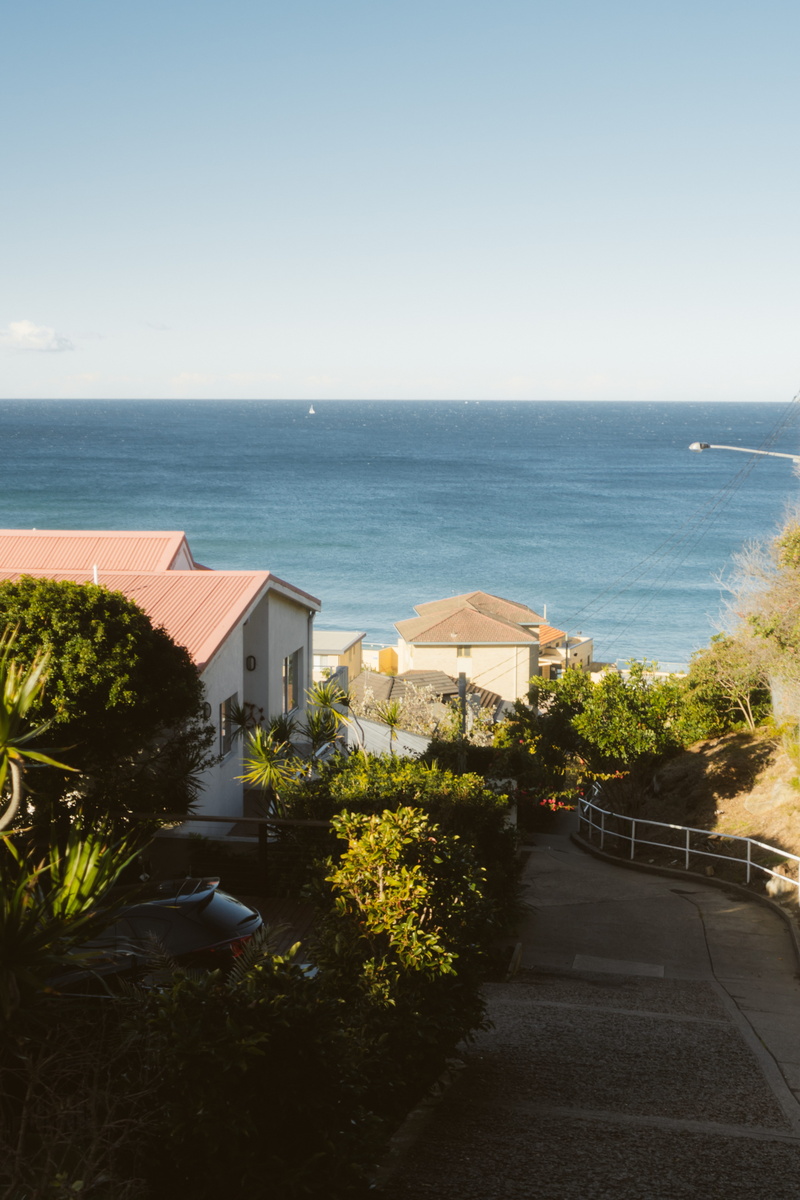 blow, tree, beachside, coast, sky, beach hut, view, views, high angle view, sunlight, beach house, shortline, blowing, bungalow, coastal house, road, house