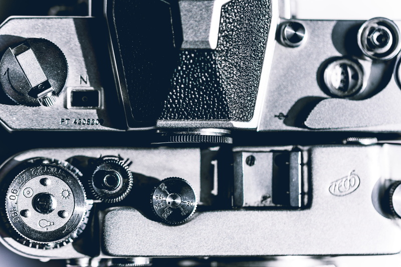 day, full frame, backgrounds, lens cap, silver colored, sun, sewing, cassette player, no people, electronics, gear, machinery, industry, technology, digital camera