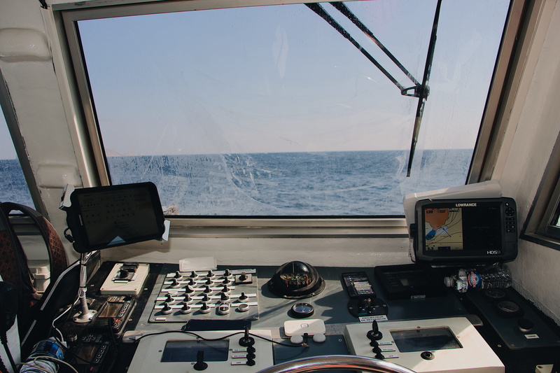 airplane, desk, window, tower, horizon over water, table, horizon, computer hardware, machine, no people, glass - material, display, sea, screen, computer