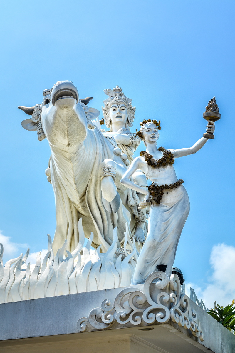 human representation, female likeness, nature, gold, god, sculpture, creativity, decorated, male likeness, art and craft, bali, cow, day, krishna, indonesia