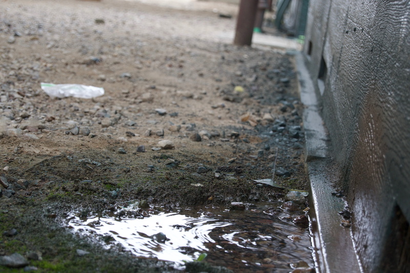 drain, winter, field, no people, dirt road, cold temperature, tire, gravel, apparel, selective focus, clothing, road, high angle view, land, dirt, water
