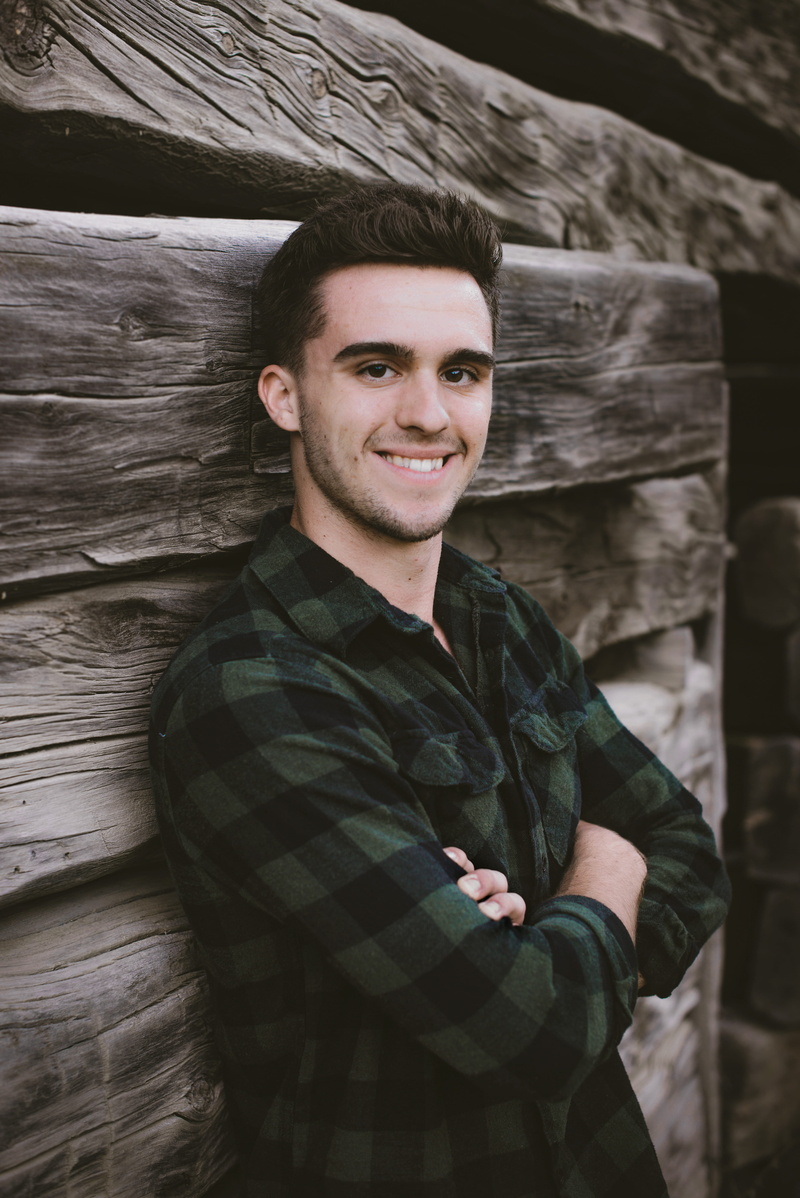 leisure activity, wall, wooden, male, wood, real people, males, men, backround, leaning, young, casual clothing, short hair, young adult, one person, man