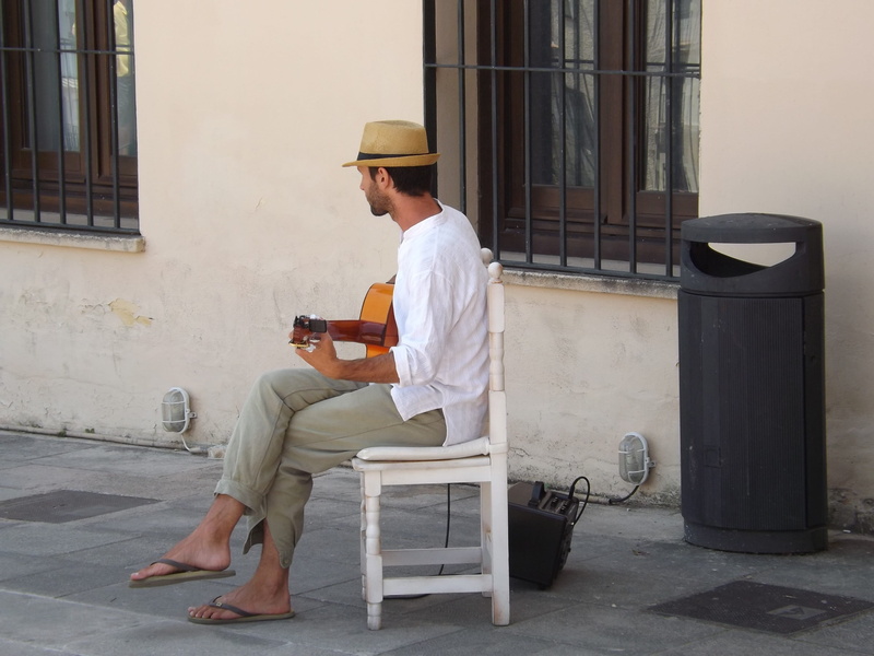 2K, seat, outdoor, architecture, casual clothing, hat, street, hand, clothing, man, sound, instrument, side view, leisure, men, built structure, real people