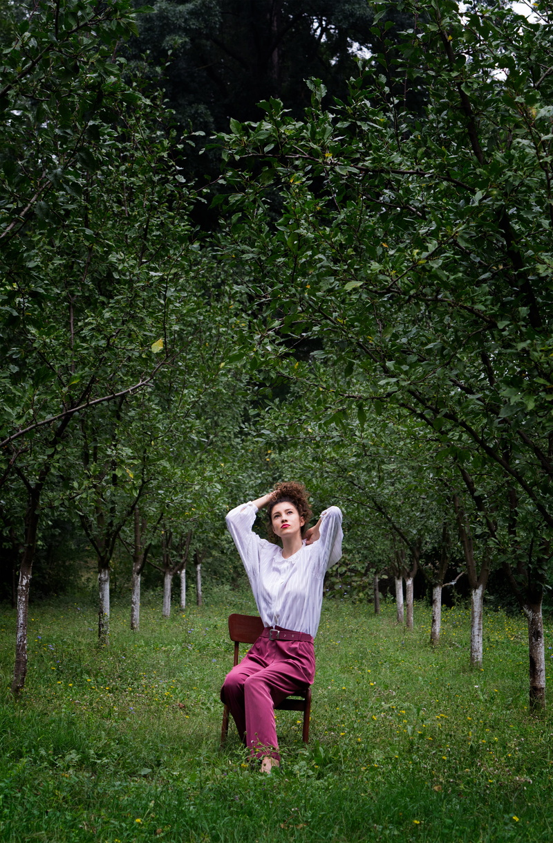 outdoors, daytime, one person, day, full length, orchard, casual clothing, front view, lifestyles, model, trees, spring, green color, brown, nature, green