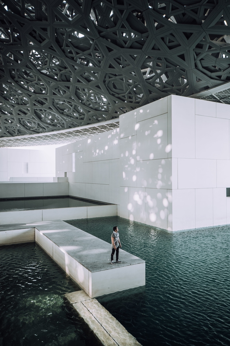 standing, male, men, person, 5K, architecture, minimal, inside, near, built Structure, sunlight, indoors, business, wall - Building Feature, pool, city