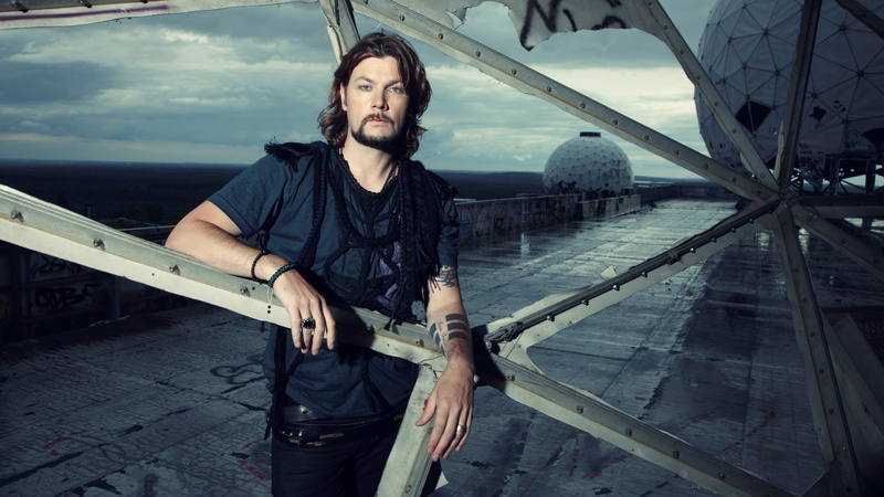 black, looking at camera, men, day, outdoors, casual Clothing, real people, standing, transportation, bridge - Man Made Structure, facial hair, tattoo