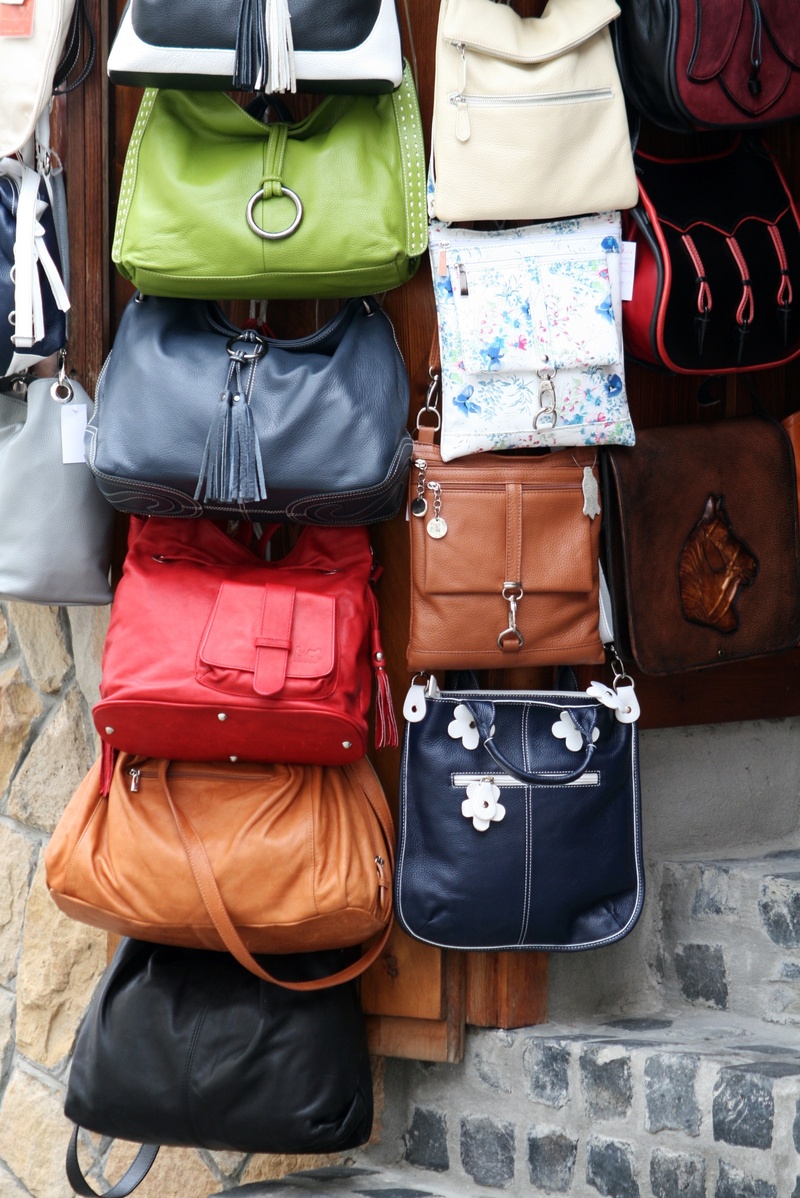 showcase, clothing, rear view, midsection, luggage, shop, fair, three quarter length, street, travel, backpack, bag, suitcase, shoulder bag, one person