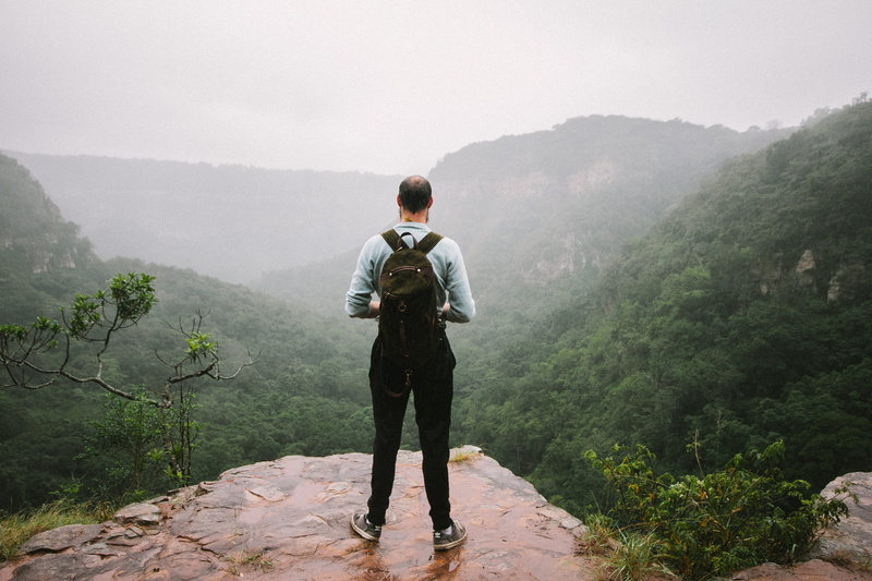 backpack, one person, rucksack, misty, non-urban scene, male, 2K, ledge, tree, rain, nature, mountains, beauty in nature, trees, caucasian, men, tranquility