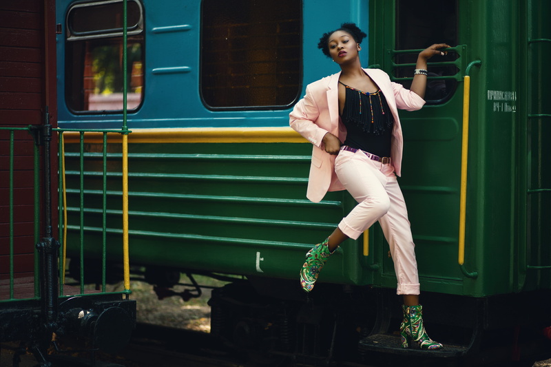 african, portrait, beautiful woman, adult, lifestyles, train, transportation system, shot, clothing, vehicle, casual clothing, sit, front view, pose, train station