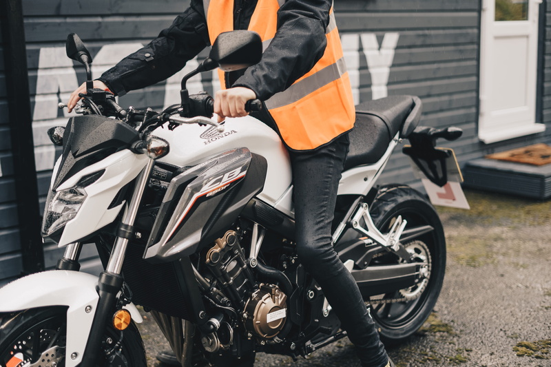 land vehicle, motor, clothing, mode of transportation, human body part, chester, sports, white, jacket, riding, vehicle, human, stationary, machine, the ride academy