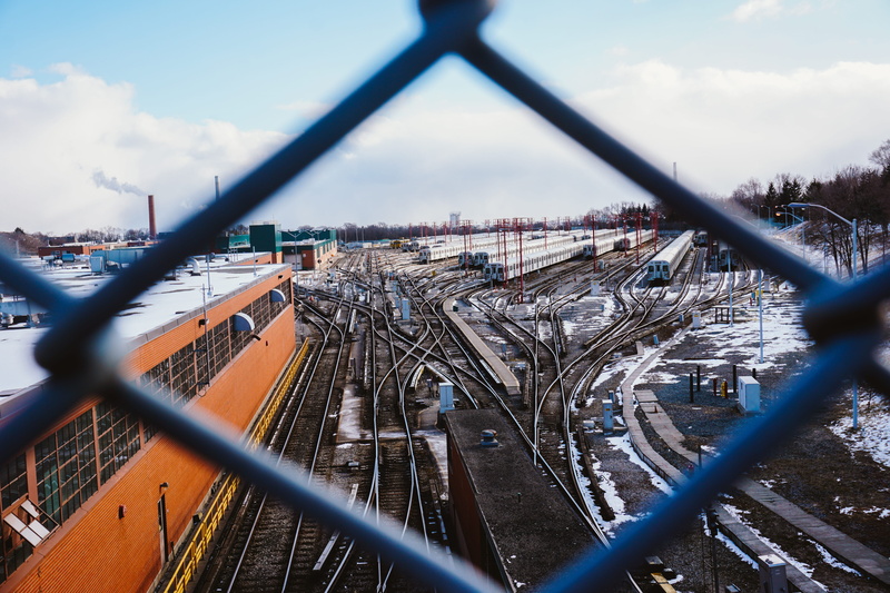 train, nature, sky, chainlink fence, 5K, toronto, track, urban, focus on background, industrial, architecture, public transportation, transportation, mode of transportation