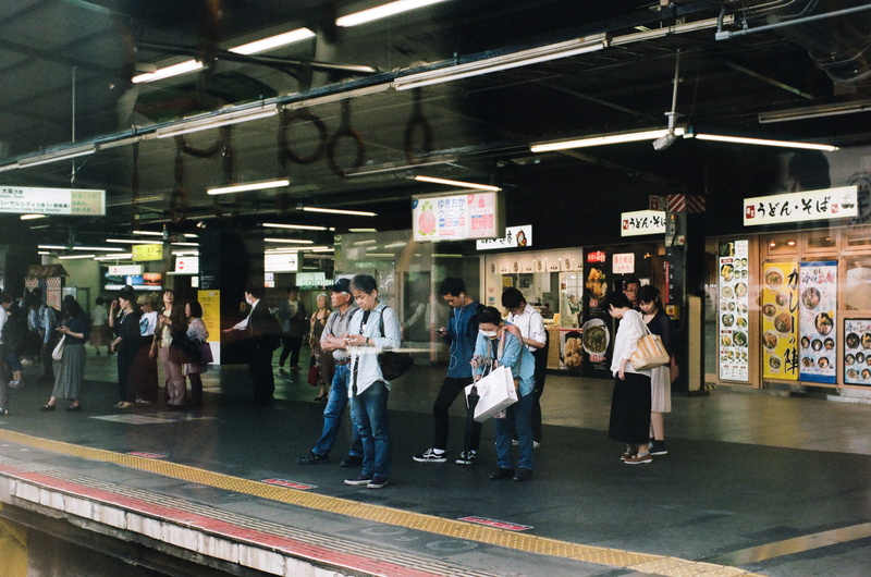 travel, station, urban Scene, adult, person, illuminated, group, city Life, women, men, railroad station, indoors, transportation, editorial, crowd, text