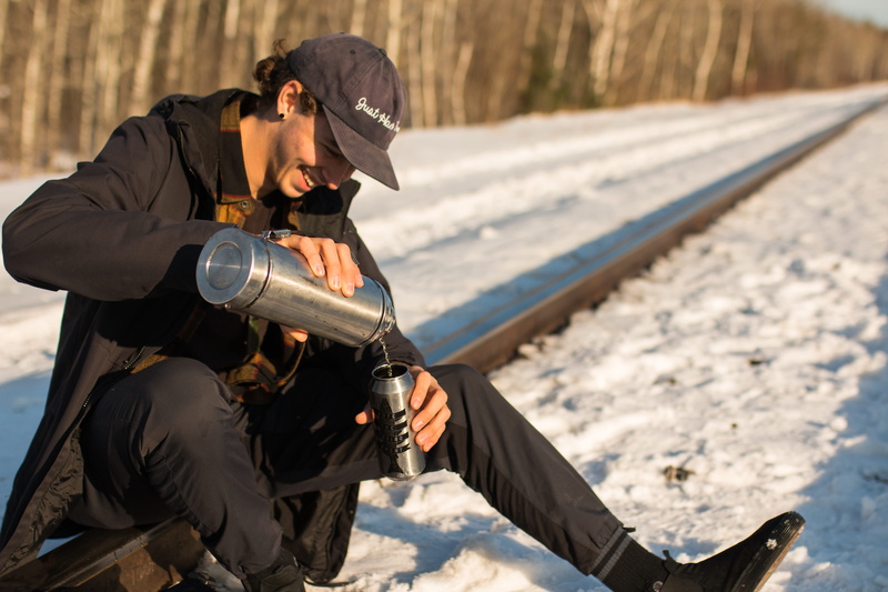 young men, snow, holding, hiking, adult, sunlight, forest, lifestyles, wilderness, smile, real people, christmas, men, 5K, side view, outdoors, digital single-lens reflex camera