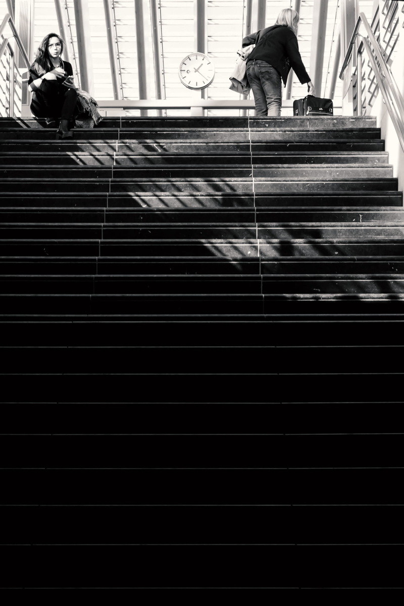 black, staircase, black and white, women, waiting, liège, stairs, rear view, men, railing, one person, architecture, blackandwhite, real people, woman