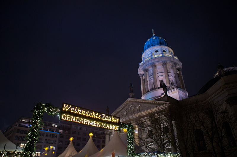 architecture, history, place of worship, built structure, christmas market, communication, text, travel destinations, building exterior, sky, nature, illuminated