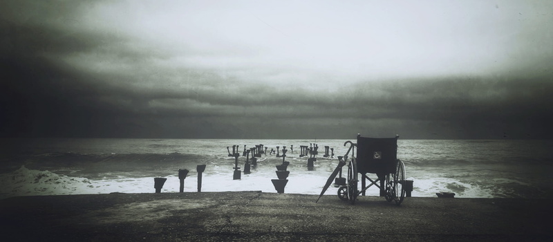 horizon, landscape, day, people, disability, land, scale, sea, cloud - sky, leisure activity, beach, chair, photograph, wheelchair, horizon over water