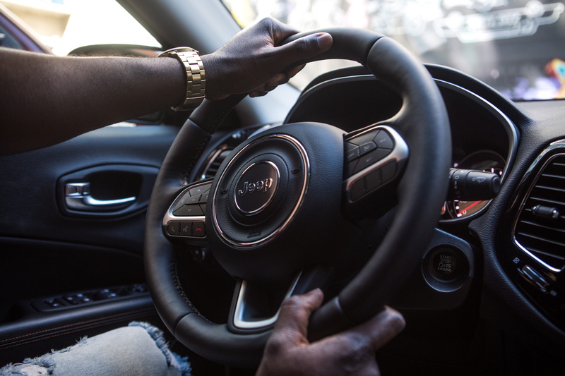 focus on foreground, body part, human hand, finger, windshield, wheel, land vehicle, holding, real people, transportation, transportation system, auto