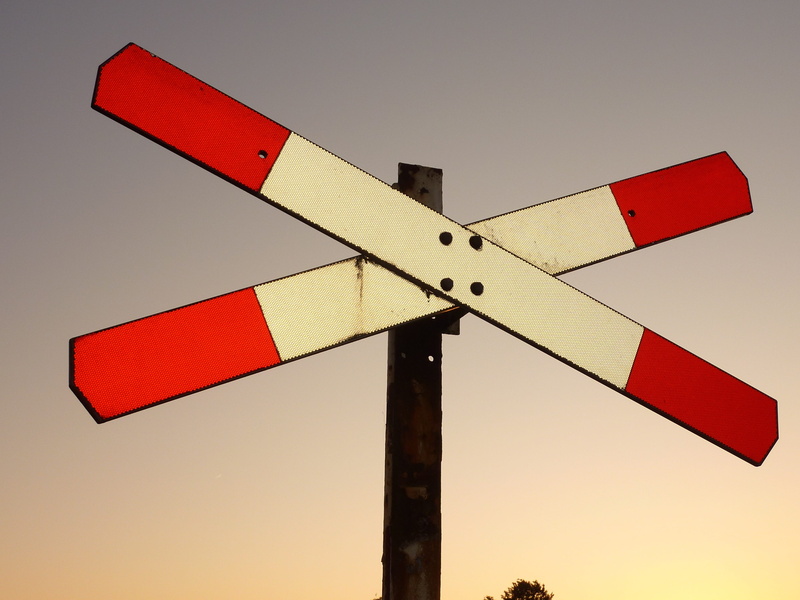 road sign, track, arrow symbol, railway line, outdoors, red, transportation, communication, 2K, low angle view, countryside, no people, dutch train, pole