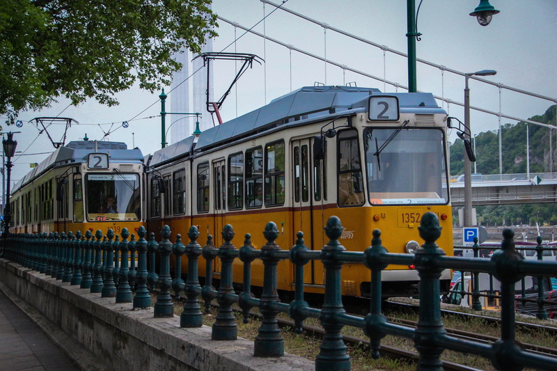 budapest, city, 2, track, mode of transportation, real people, building exterior, railing, tree, clear sky, day, plant, cable car, transportation, bus