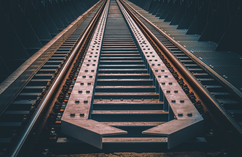 vanishing point, in a row, no people, absence, indoors, railway, diminishing perspective, pattern, railroad track, transportation, direction, traffic, transport