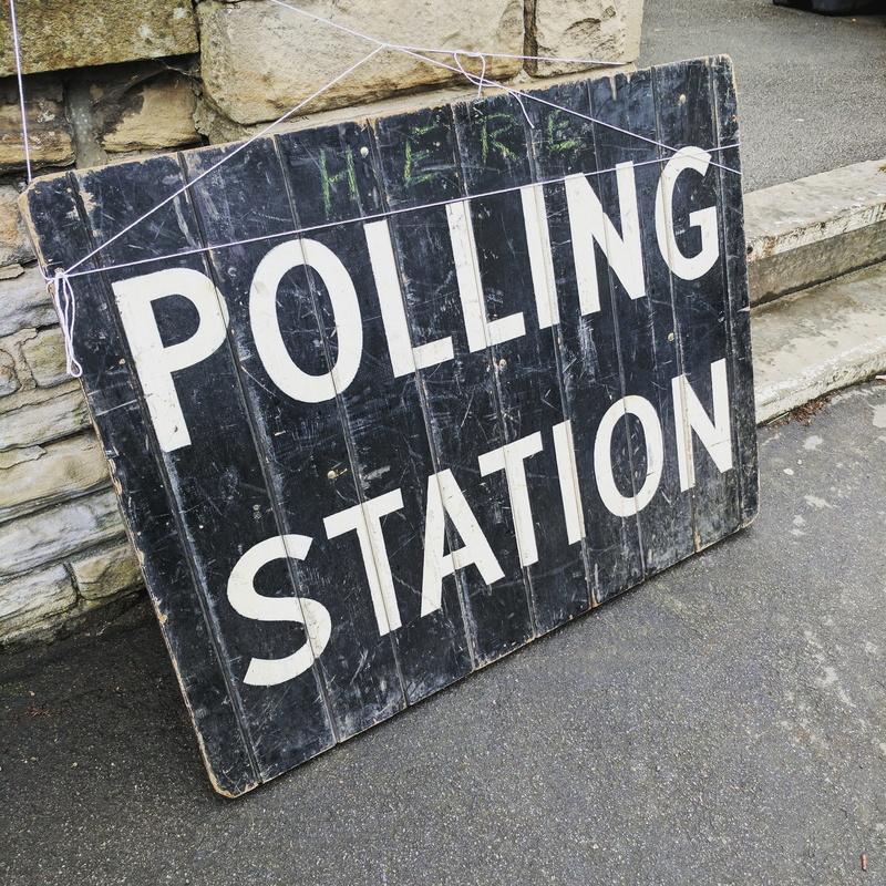communication, station, street signs, blackboard, high angle view, poll, 2K, chalkboard, polling, uk, architecture, wall, election day, street, signage