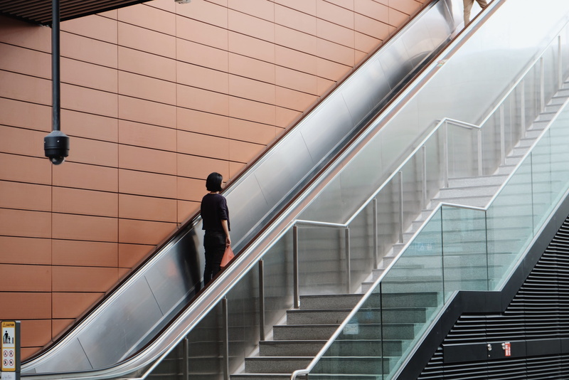 railing, one person, full length, monitor, human, going, men, child, adult, banister, modern, display, indoors, built structure, electronics, handrail