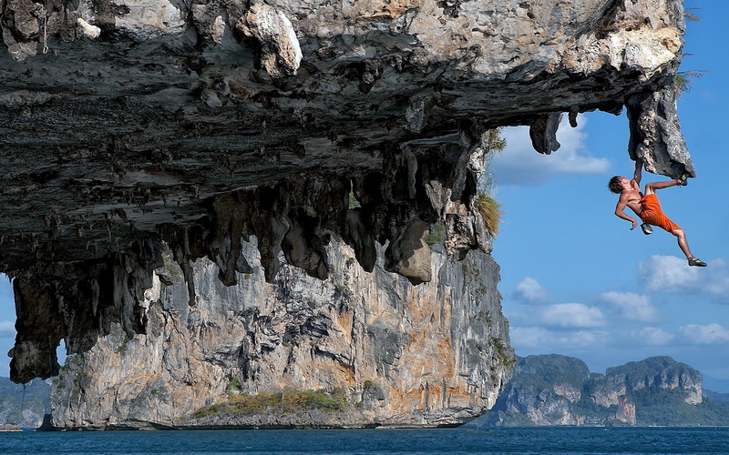 lifestyles, men, gray, leisure activity, sport, cliff, formation, one person, water, real people, vitality, climbing, nature, rock, adventure, full length