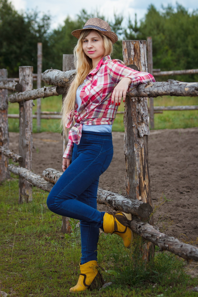 grass, teenager, hay, subsistence farming, cowboy, wooden, full length, girl, living nature, women, russia, casual clothing, smiling, arm, hairstyle, real people