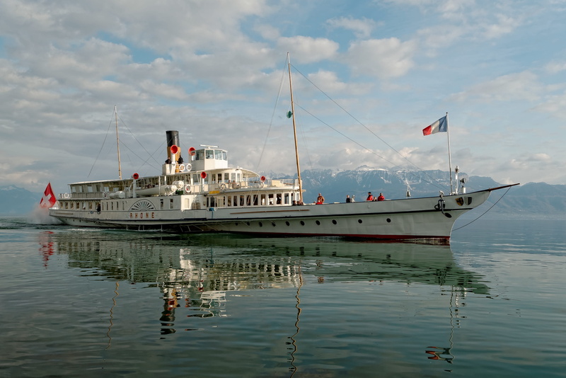 geneva, patriotism, reflection, nature, water, ship, clouds, blue, montreux, leman, waterfront, nautical vessel, travel, mountains, sea, lake, flag, sky