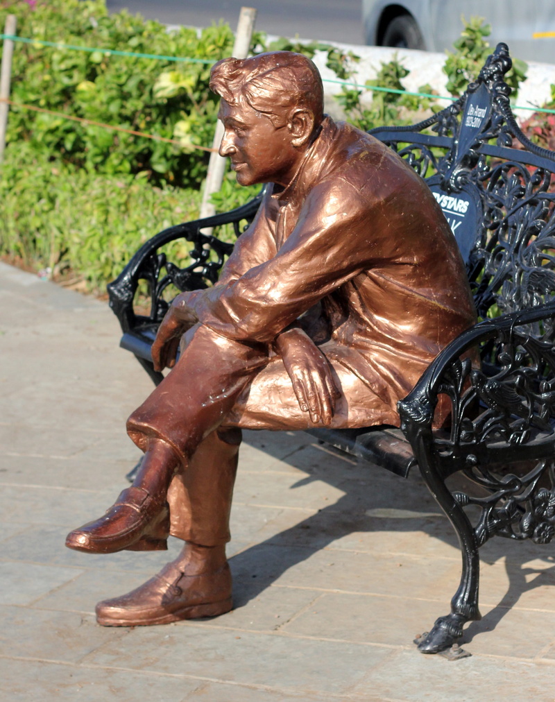 Actor, human representation, male likeness, art and craft, day, dev, sitting, absence, metal, Statue, sculpture, sunlight, Bollywood, outdoors, shadow