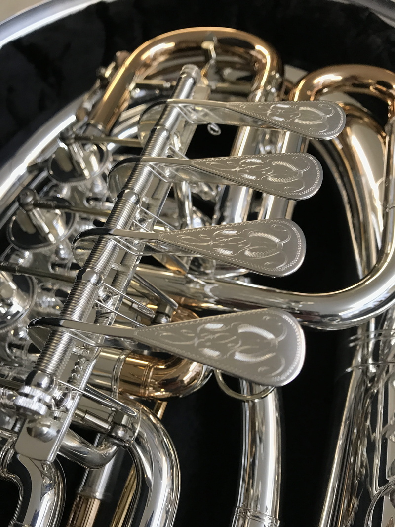 equipment, studio shot, cornet, trumpet, black background, focus on foreground, 4K, indoors, gold, metal, brass instrument, jazz music, brass, tenor horn