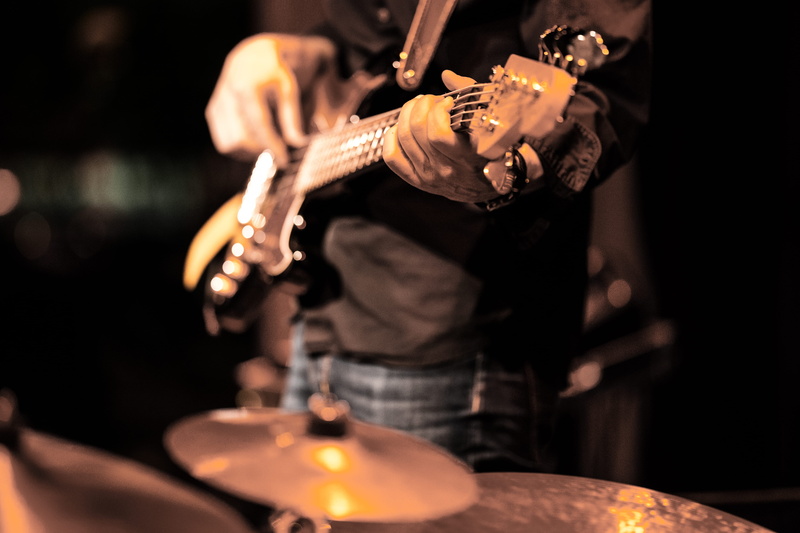 nightlife, guitar, music band, dark, musical instrument, drum, human, long sleeve, bass guitar, one person, playing, amplifier, arts culture and entertainment